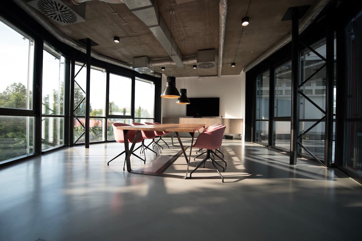 A calm, well-lit studio workspace with a long workbench and no visual noise.